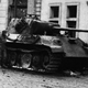 U.S. infantrymen inspect a burned-out Panther tank in front of the Beethoven Hall in Bonn, Germany on March 12, 1945.
